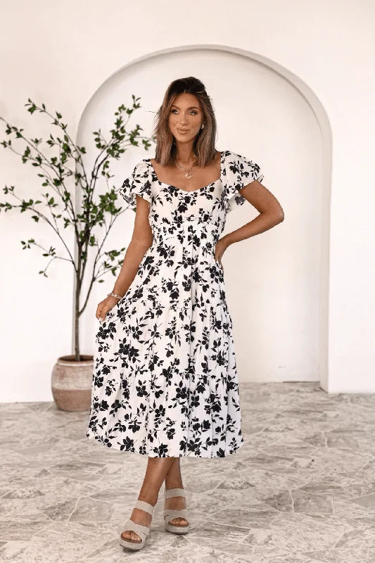 Midi dresses with belted waists to accentuate the figure Genevieve’s Floral Charm Midi Dress