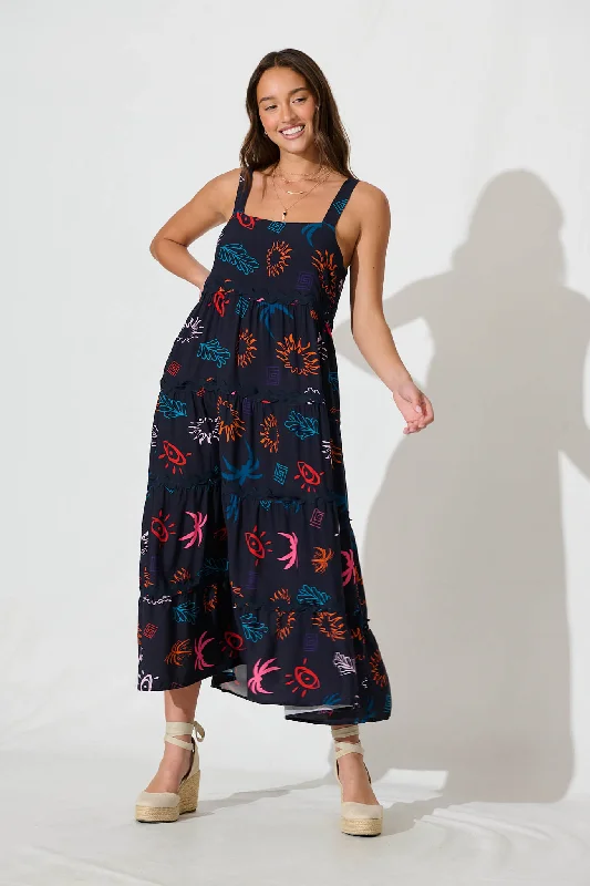 Maxi dresses with mesh panels for a sexy and trendy appearanceJolie Maxi Sundress in Navy Print With Black Ric Rac Trim